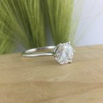 six prong moissanite solitaire engagement ring with thin band in white gold