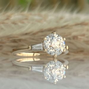 moissanite engagement rings example with tapered baguette diamonds on the side